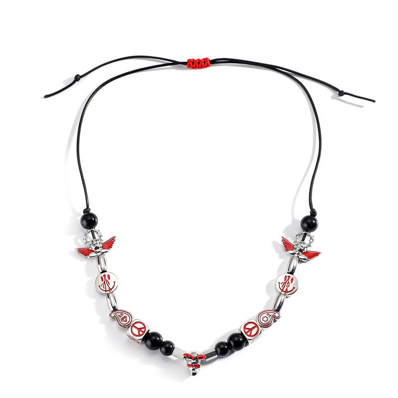 Venta al por mayor aleación Smiley Skull Angel collar de perlas negras